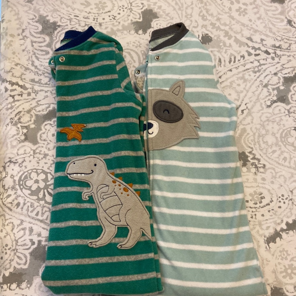 Two pairs Carter’s one piece feet pajamas size 2T